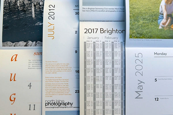 A close-up view of inner pages from Brighton and Hove Calendars from 2012, 2017, and 2025, showing monthly layouts, tide tables, and photography credits.